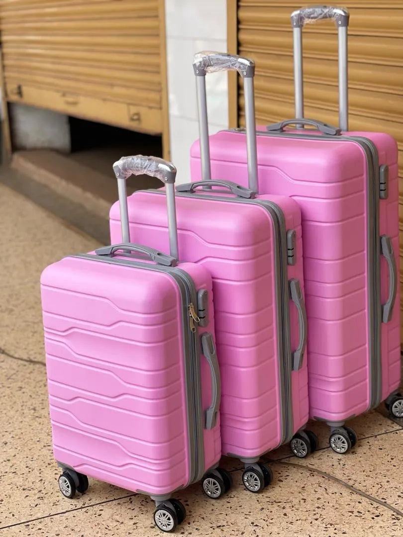 A set of three luggage suitcases color vary